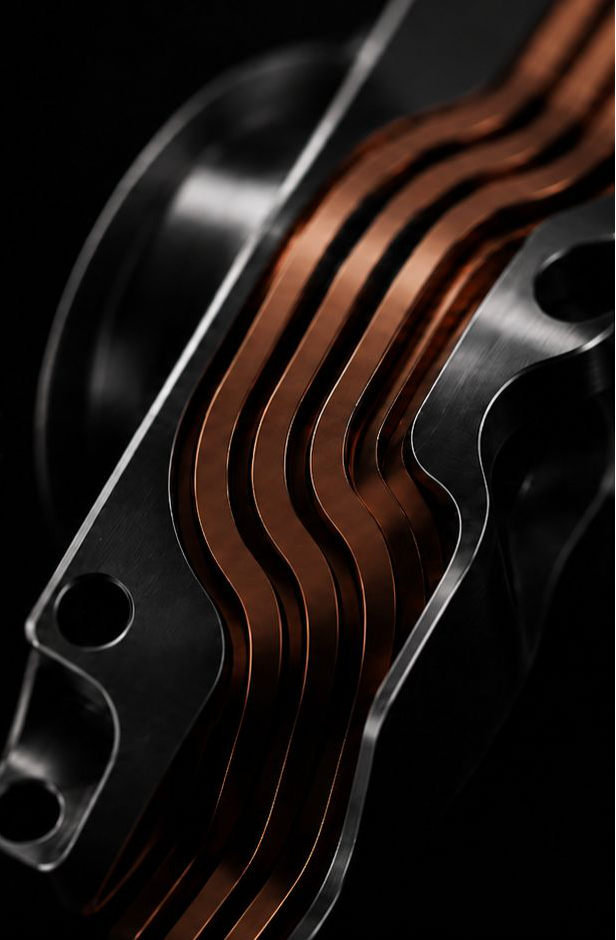 Copper heat paths integrated into a lightweight aluminum component